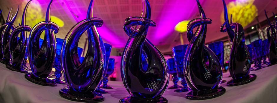 blue glass award trophies waiting to be presented