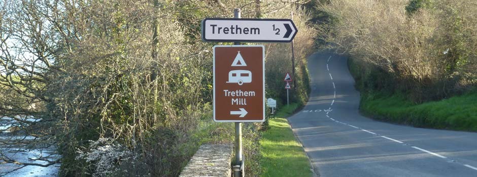 Trethem Mill brown sign on the road at bottom of the lane