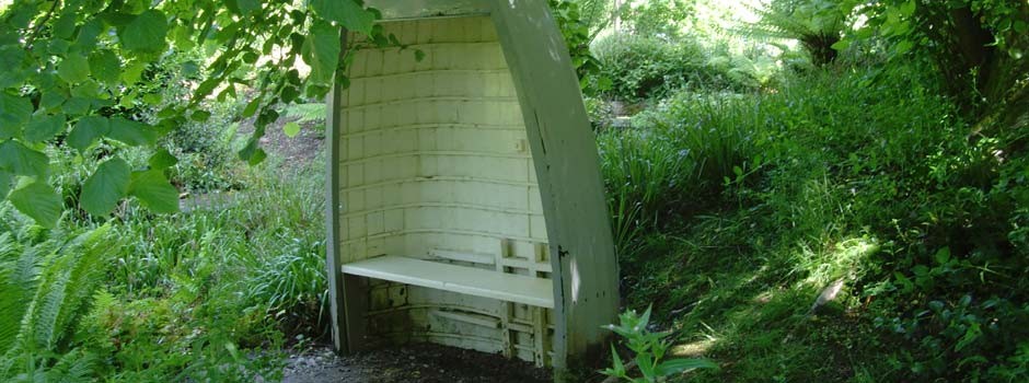 seat made from an up-turned boat in one of the local gardens