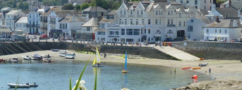 the harbour in St Mawes with sailing boats and kayaks