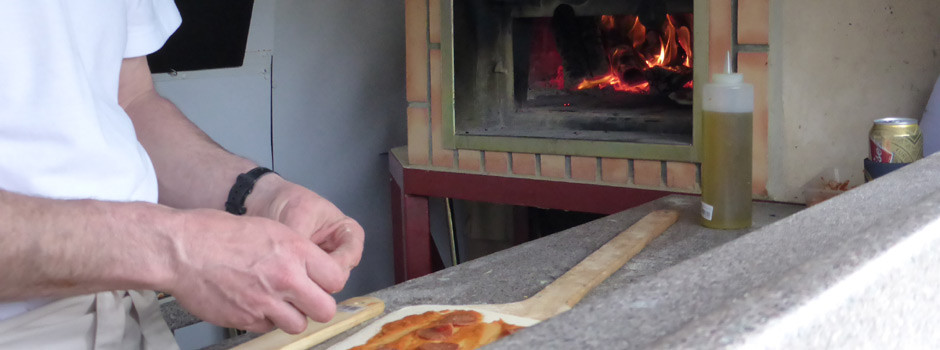 preparing wood fired pizzas on the Park